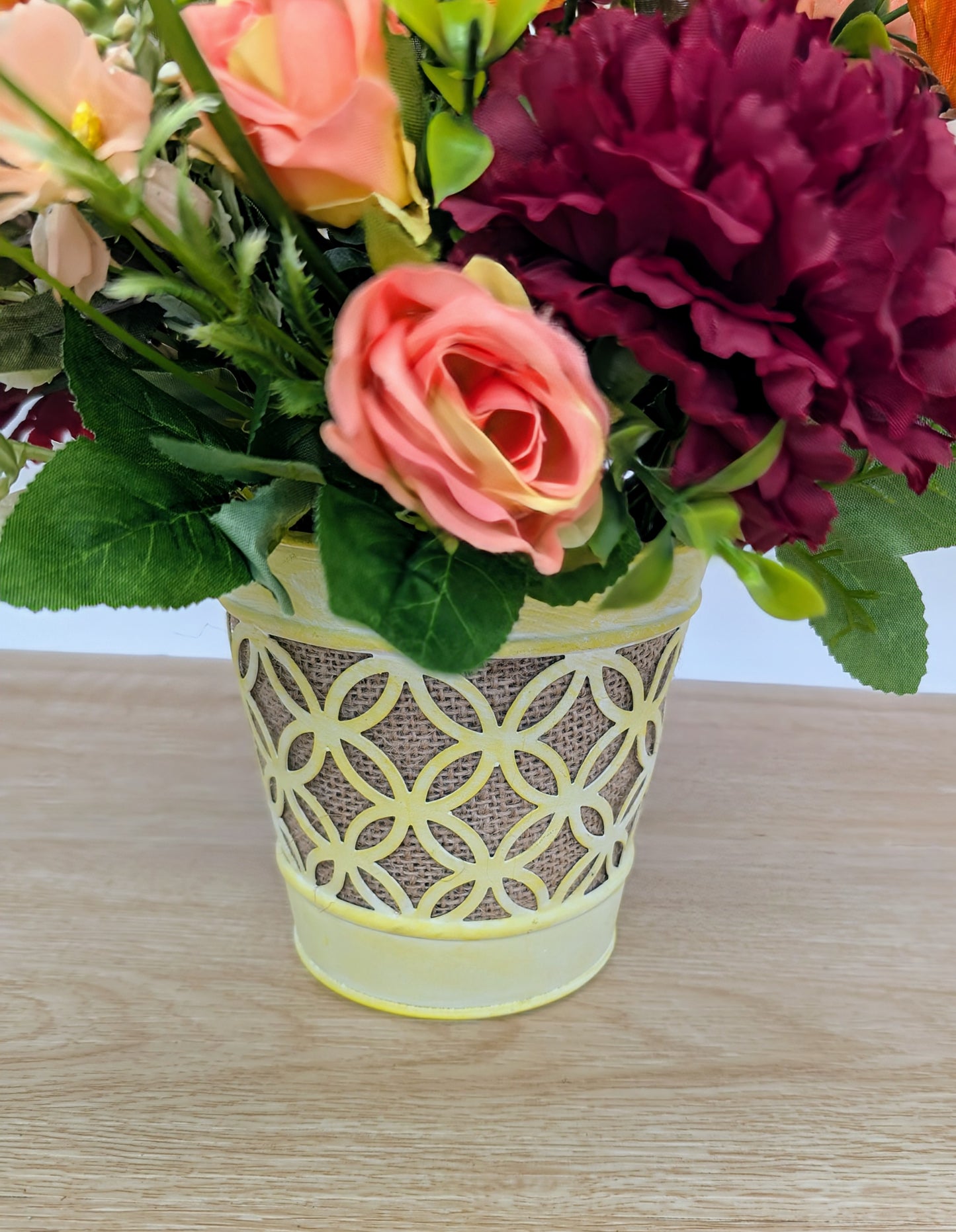Autumn arrangement in yellow pot