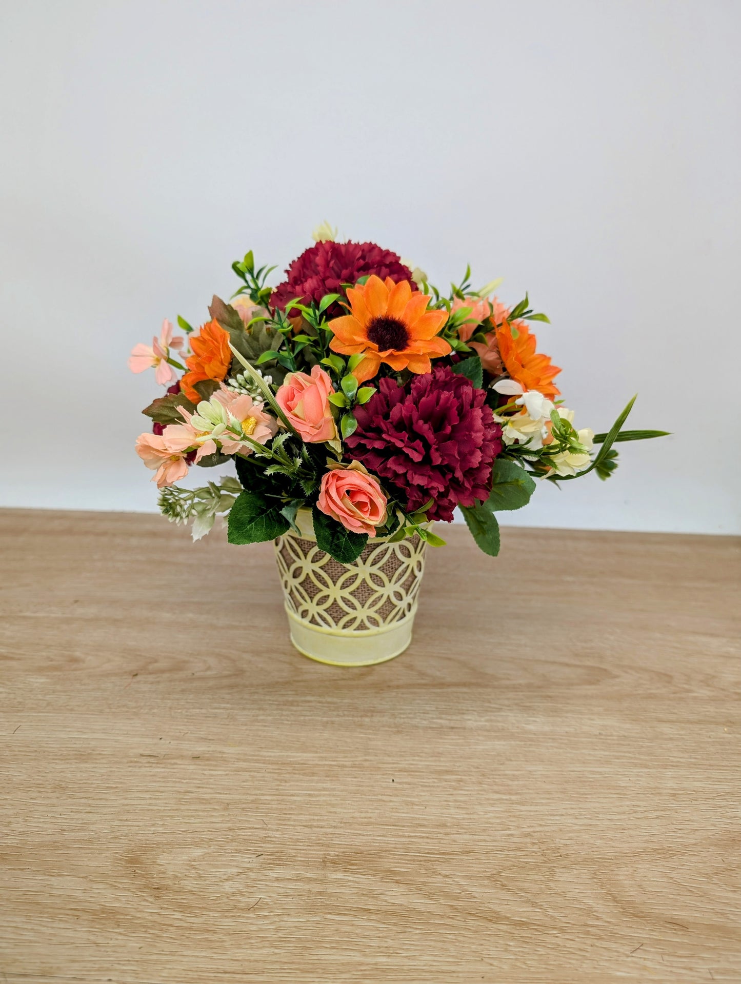 Autumn arrangement in yellow pot