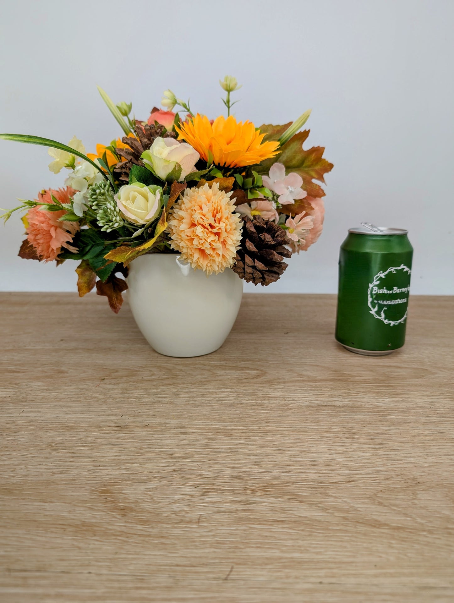 Autumn arrangement in cream pot