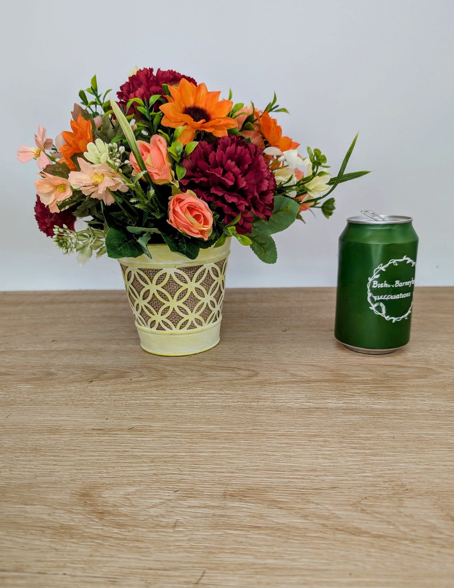 Autumn arrangement in yellow pot