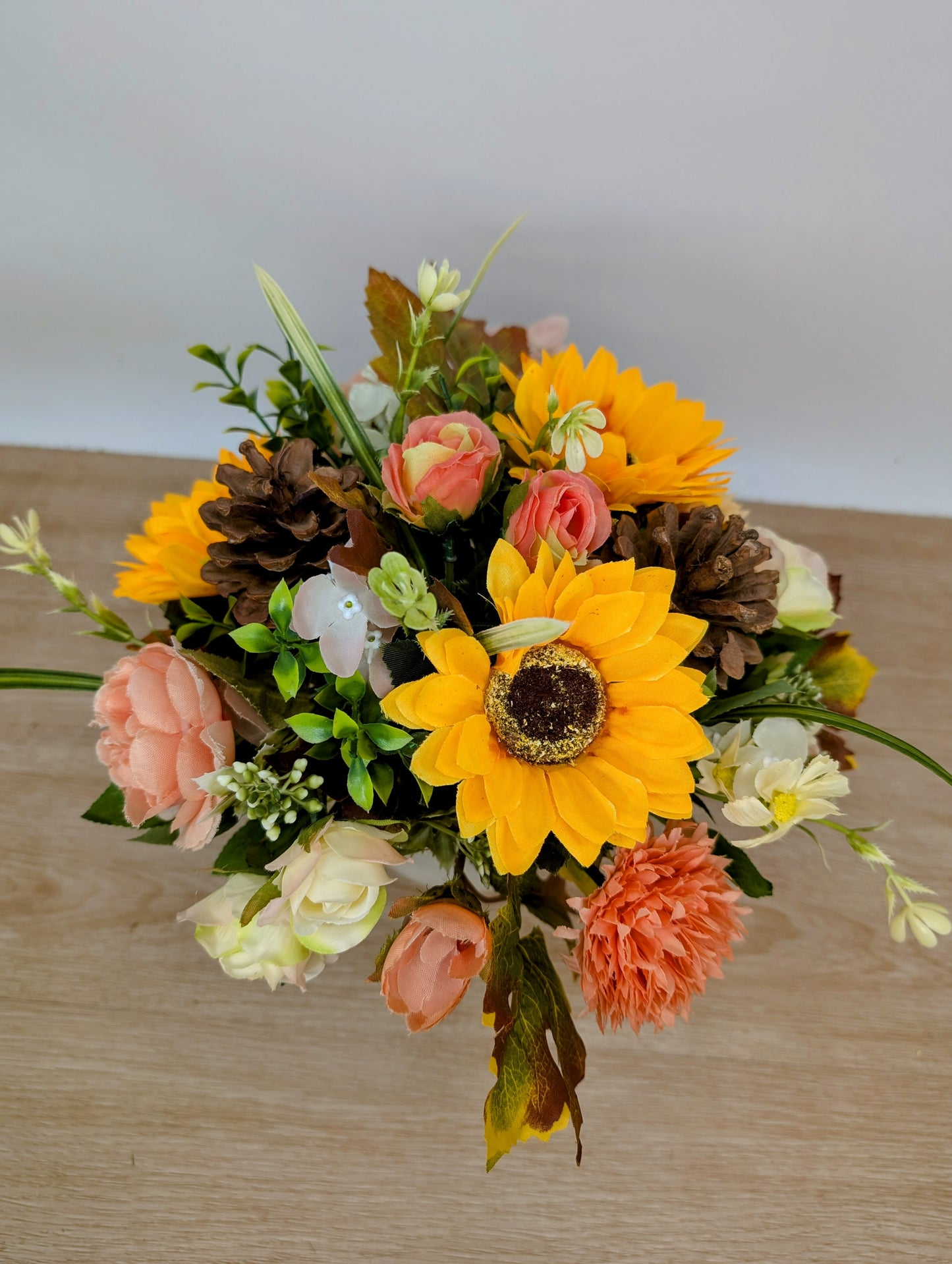 Autumn arrangement in cream pot
