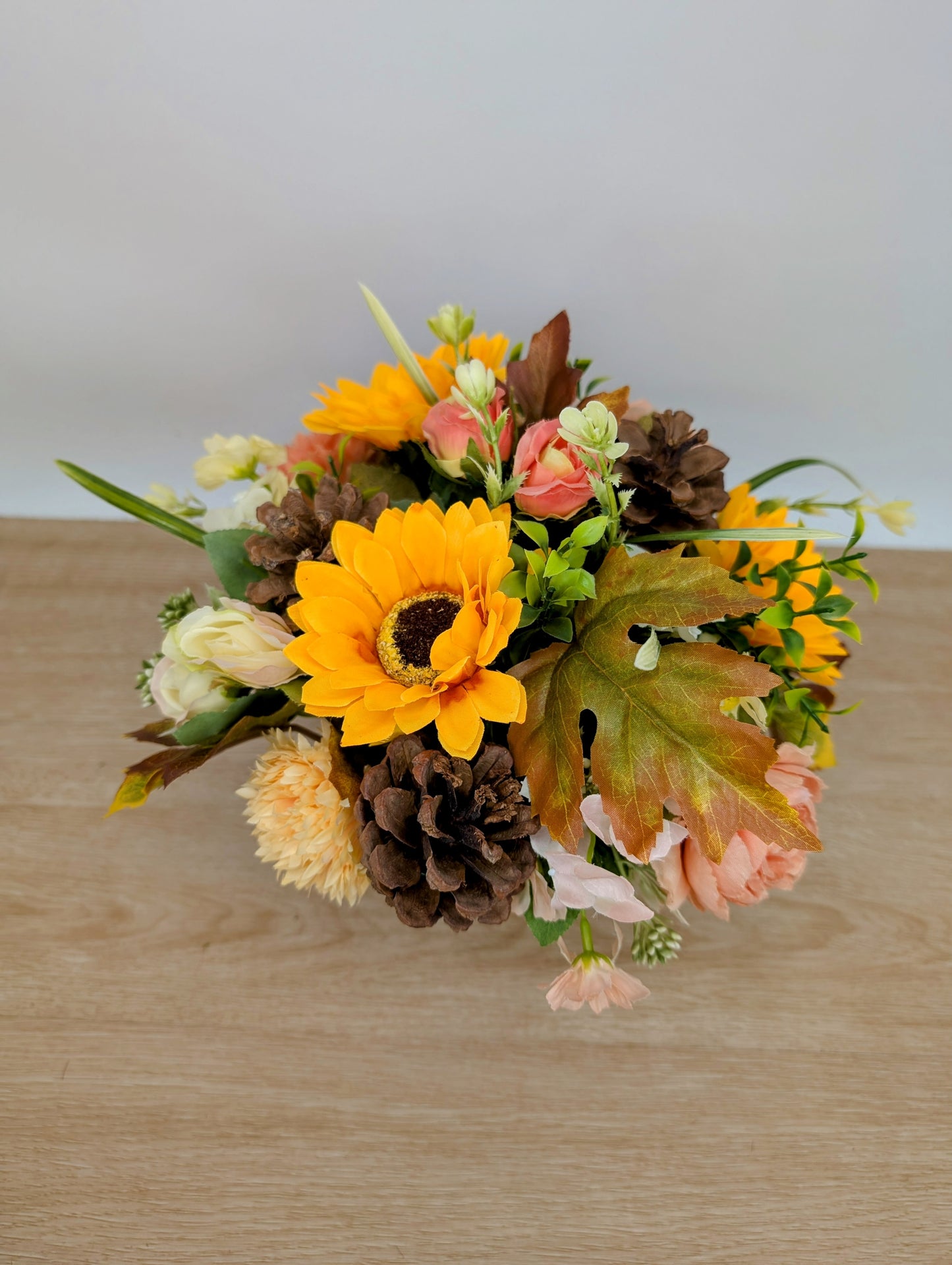 Autumn arrangement in cream pot