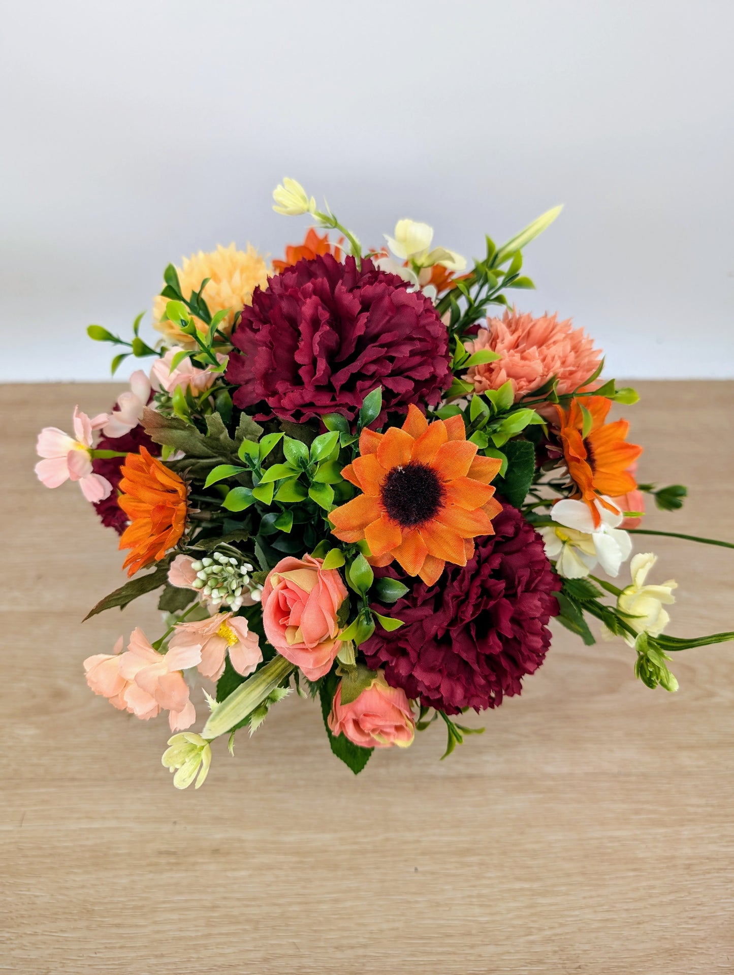 Autumn arrangement in yellow pot