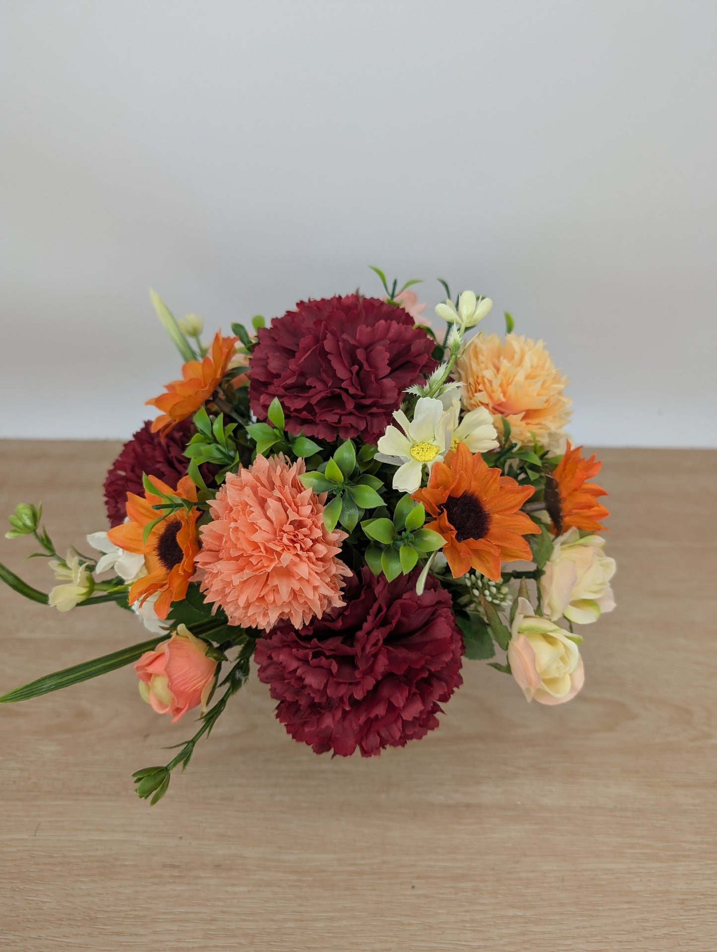 Autumn arrangement in yellow pot