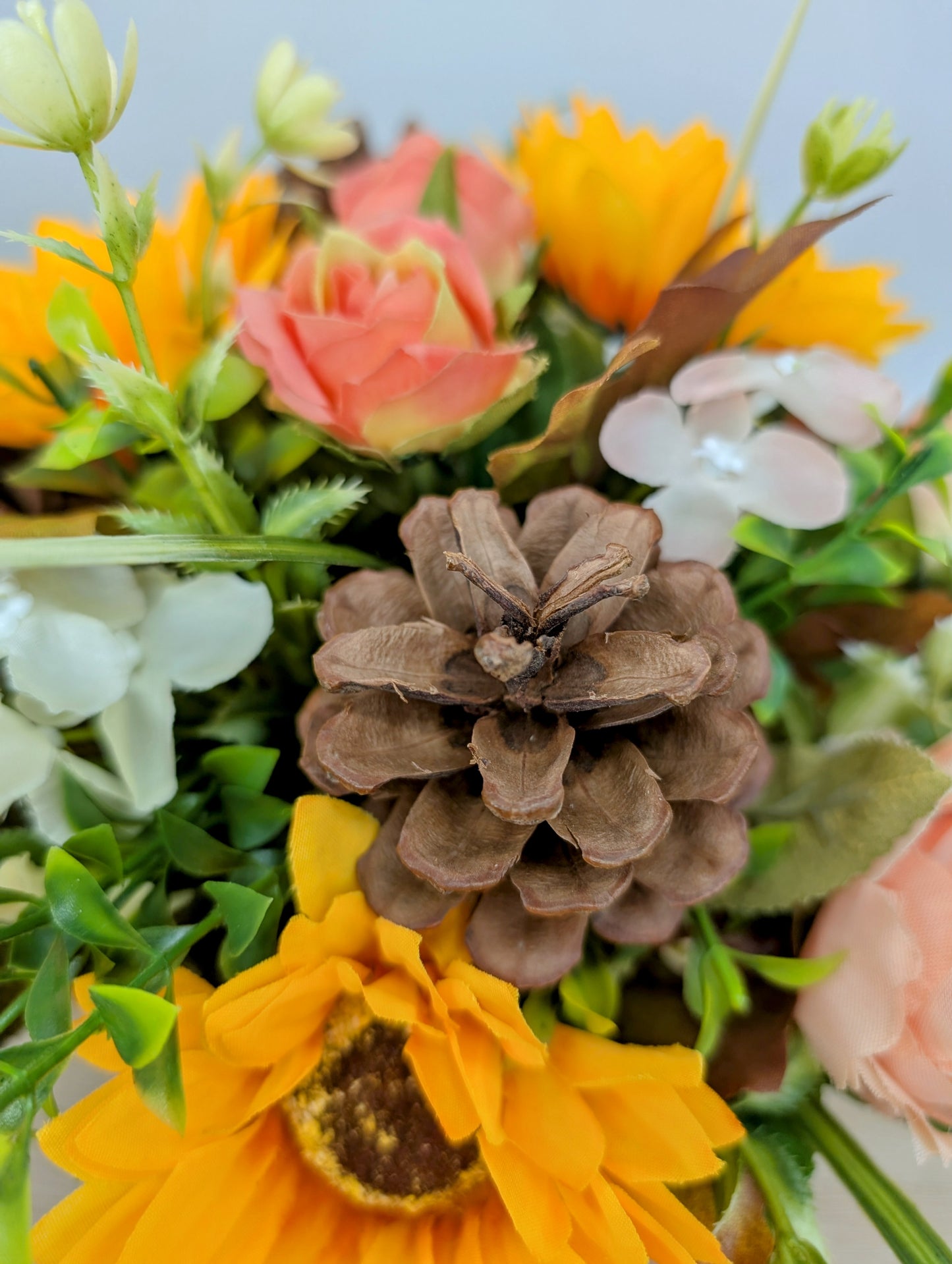 Autumn arrangement in cream pot