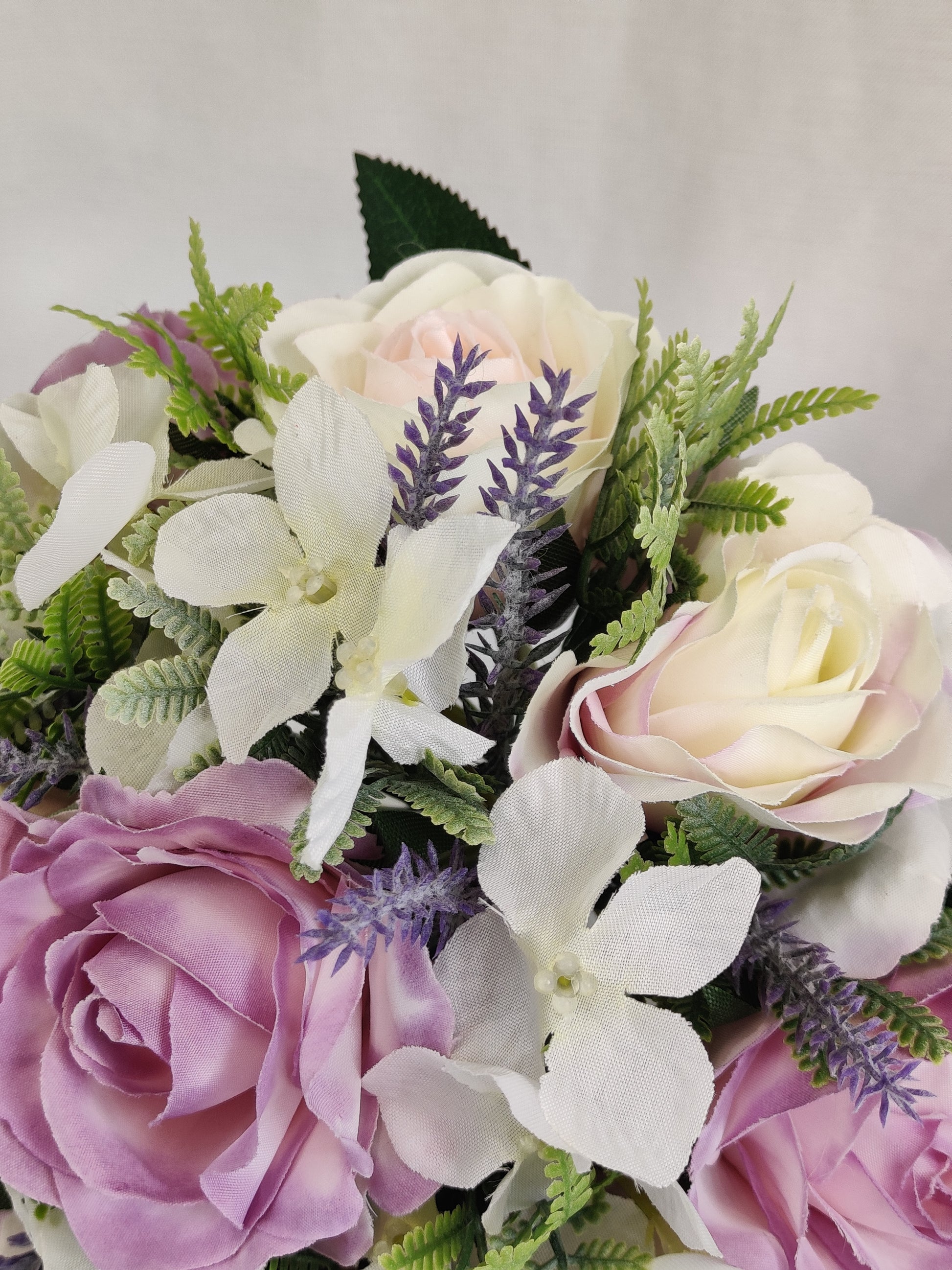 Pastel pink and purple rose wedding flowers