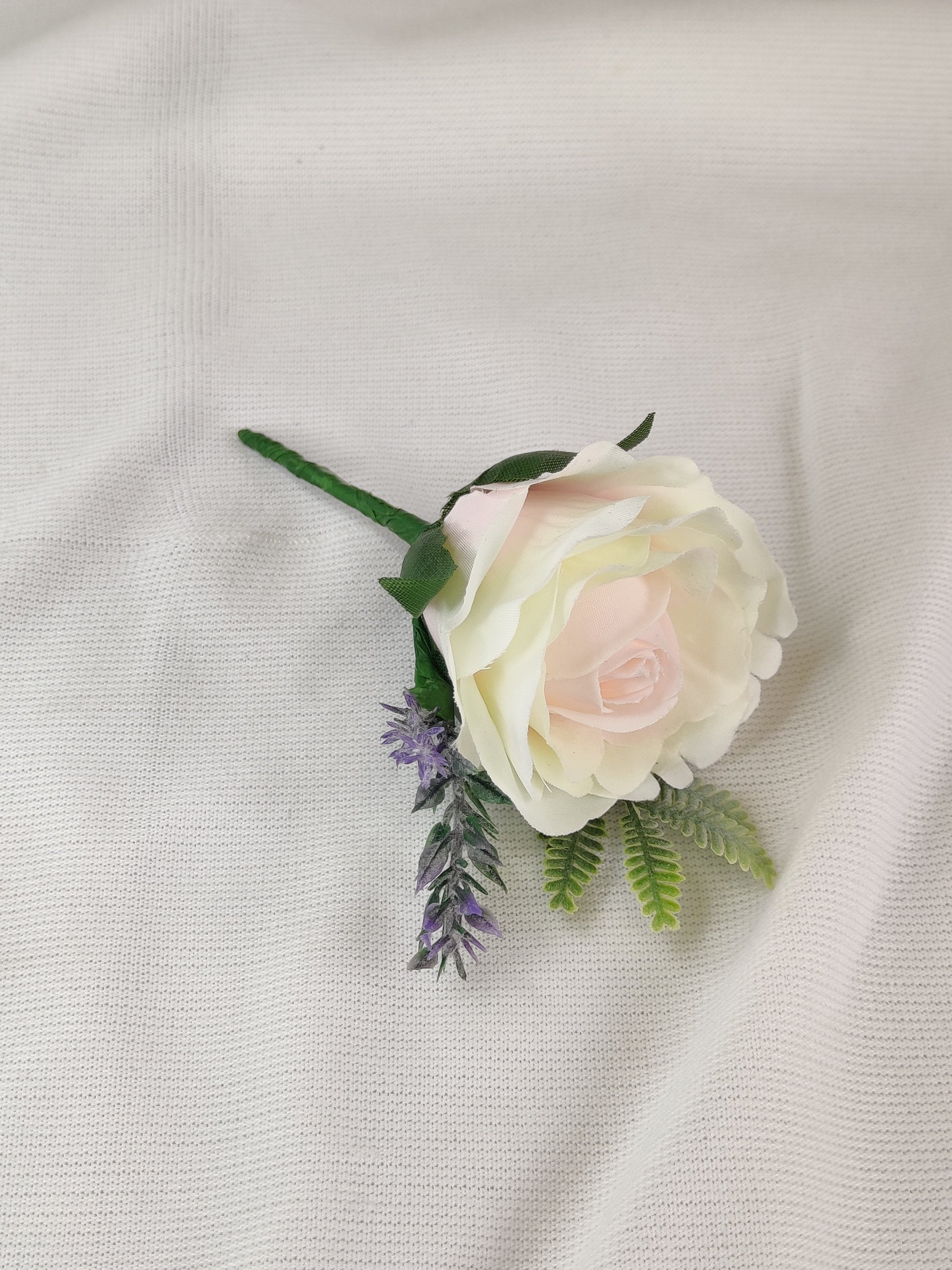 Pastel pink and purple rose wedding buttonhole 