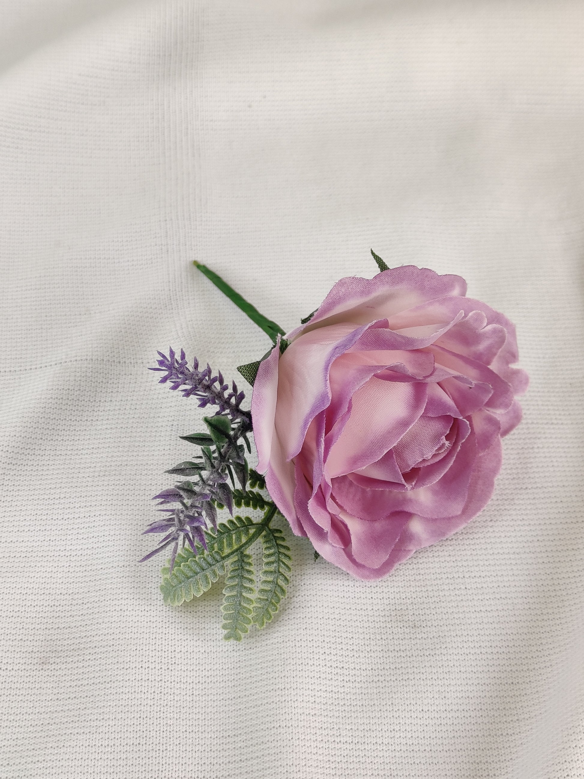 Pastel pink and purple rose wedding buttonhole 