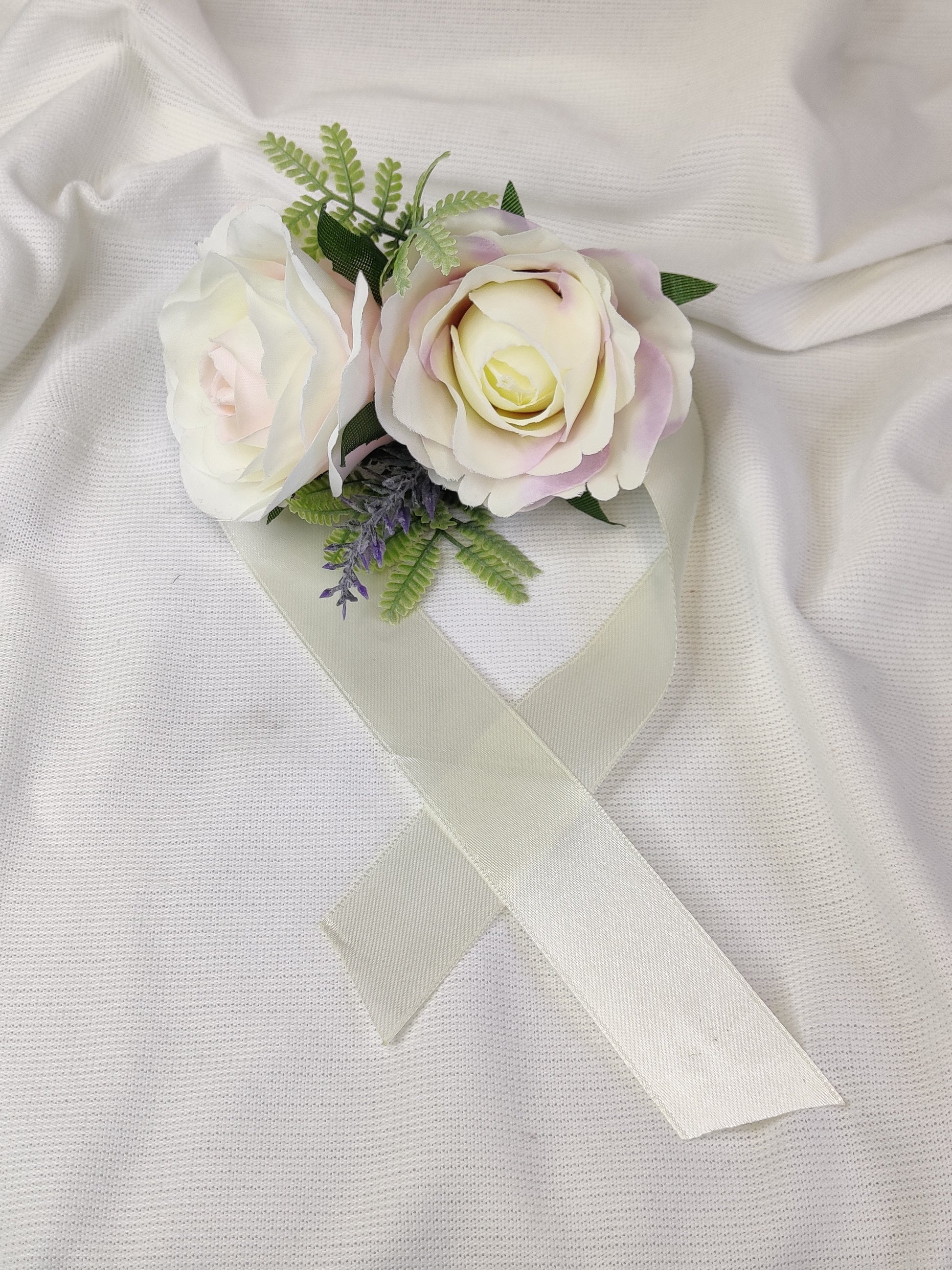 Pastel pink and purple rose wedding flowers wrist corsage