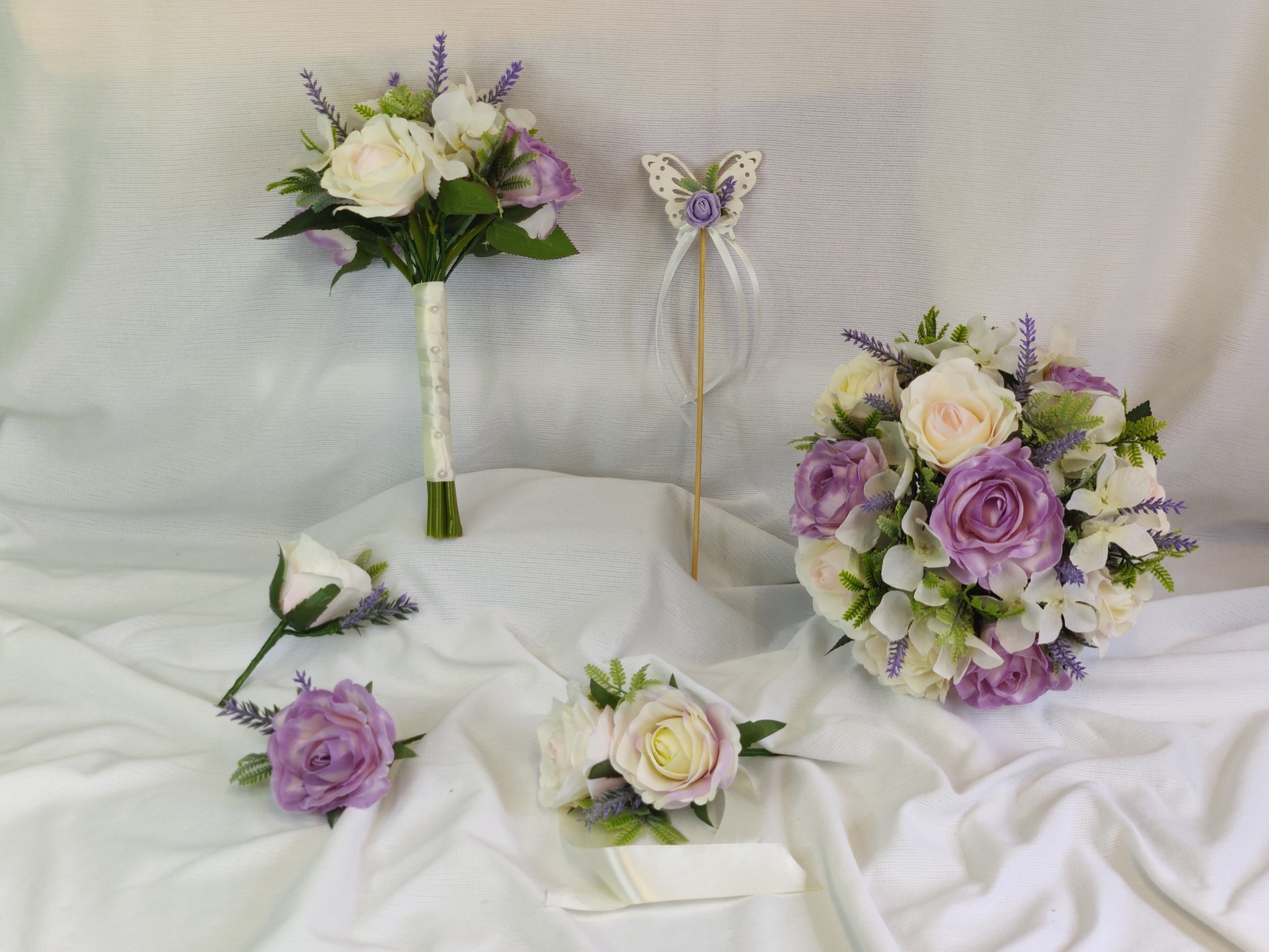 Pastel pink and purple rose wedding flowers