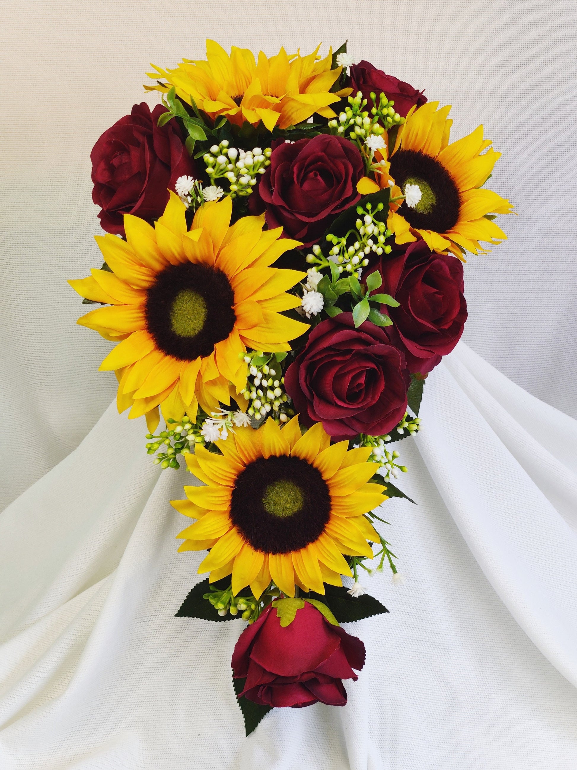 Sunflower, burgundy rose, gyp,berry and tealeaf Teardrop bouquet 