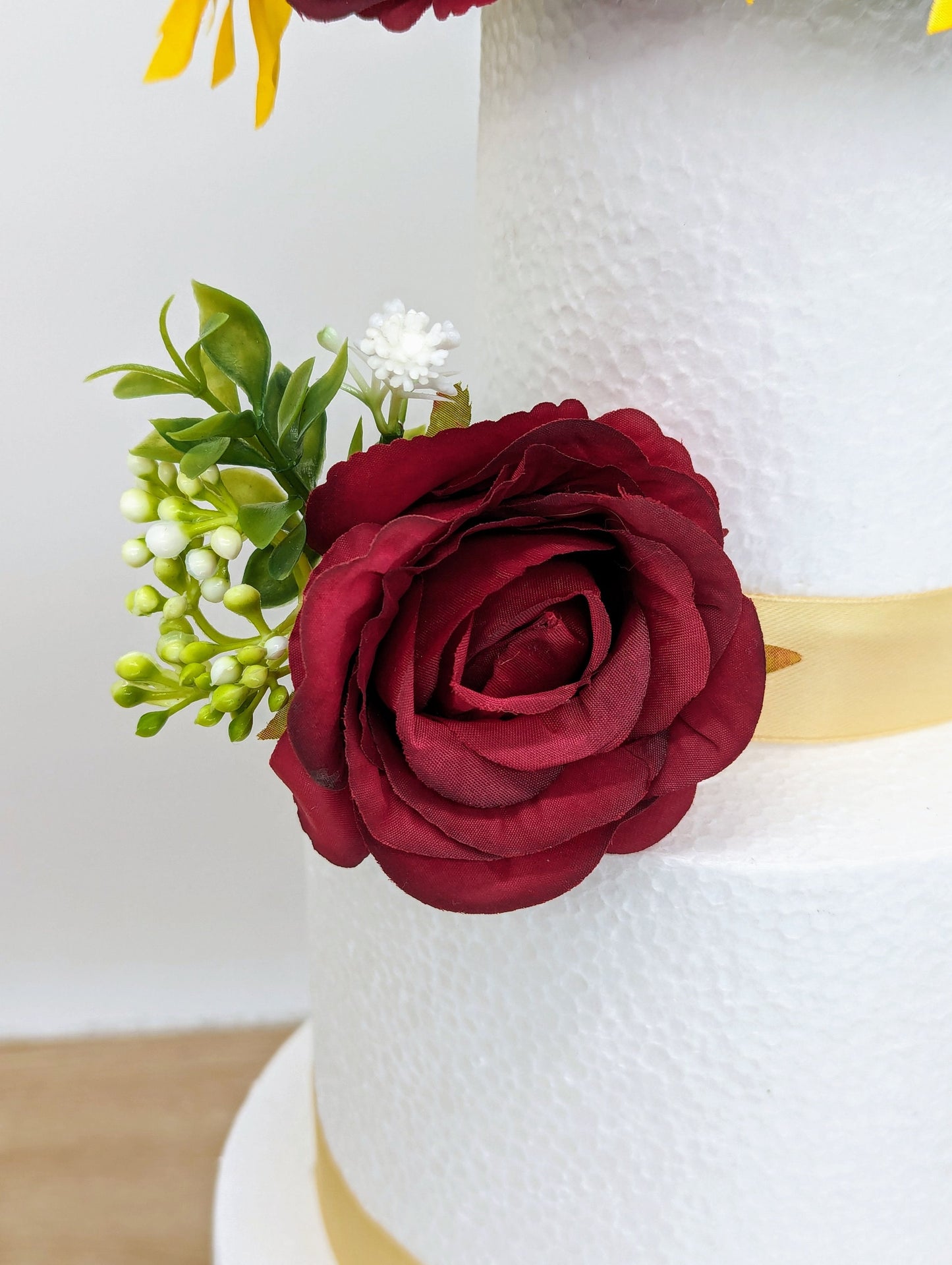 Burgundy rose and sunflower cake flowers and topper
