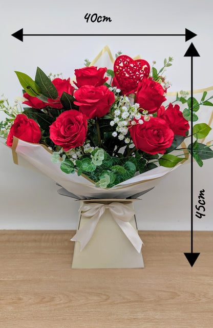 Bouquet of red roses with dimensions on a wooden surface