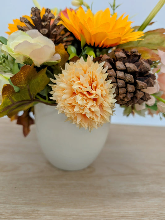 Autumn arrangement in cream pot