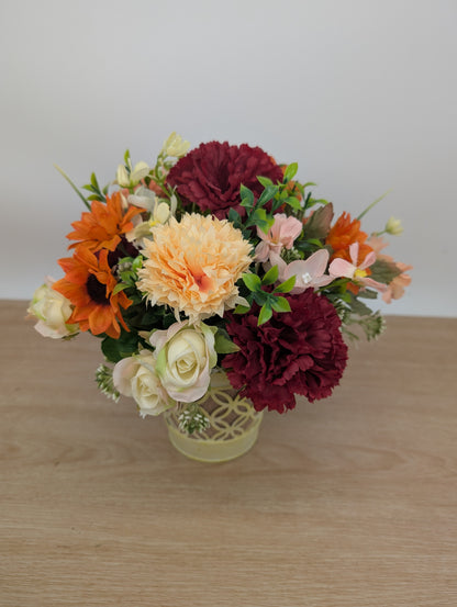 Autumn arrangement in yellow pot