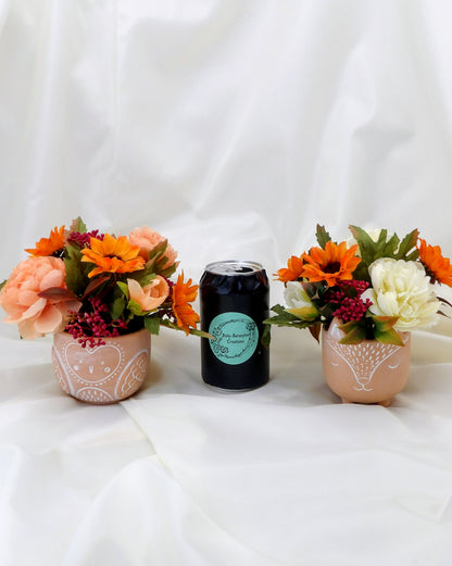 Autumn Arrangements in a terracotta Owl Pot