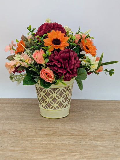 Autumn arrangement in yellow pot