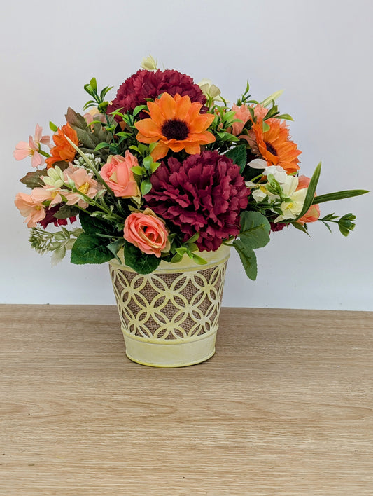 Autumn arrangement in yellow pot