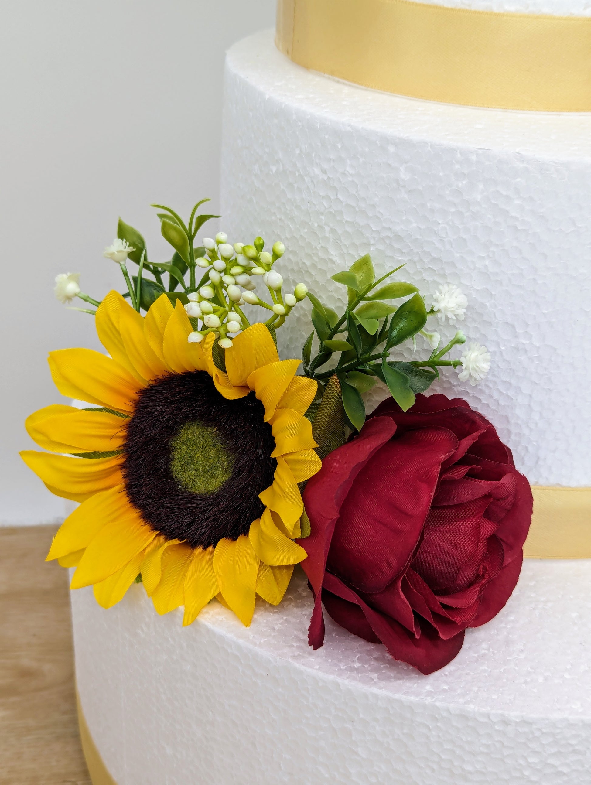 Burgundy rose and sunflower cake flowers and topper